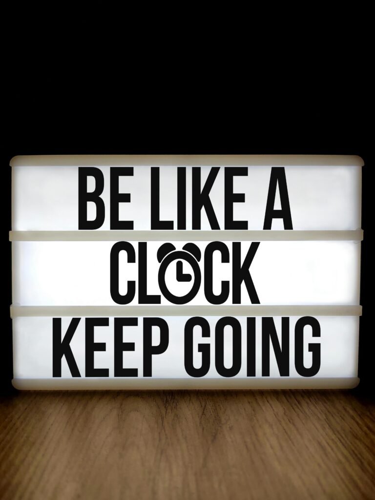 Lightbox displaying 'Be Like a Clock Keep Going' for motivation and inspiration.